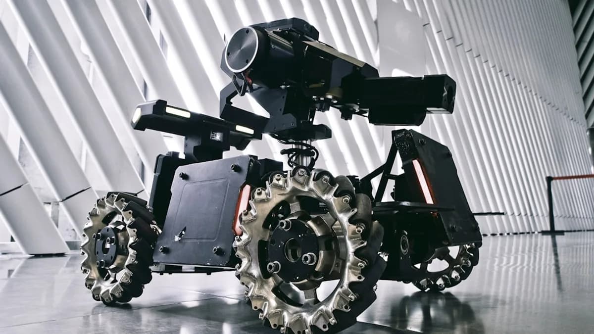 A black and white photo of a camera on wheels