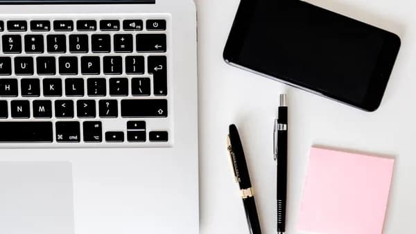 two pens near MacBook Air