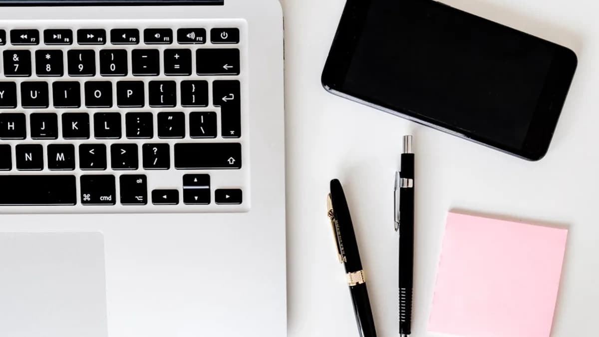 two pens near MacBook Air