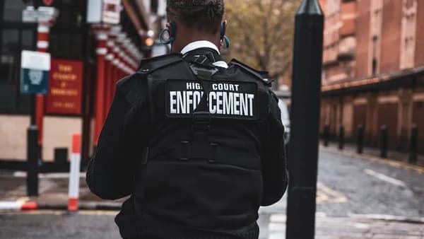 man in black and white adidas jacket wearing black and white headphones