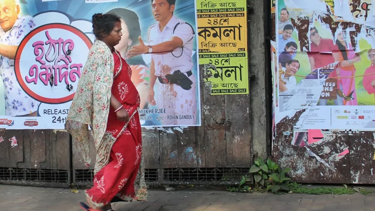 woman in red and white kimono standing beside wall