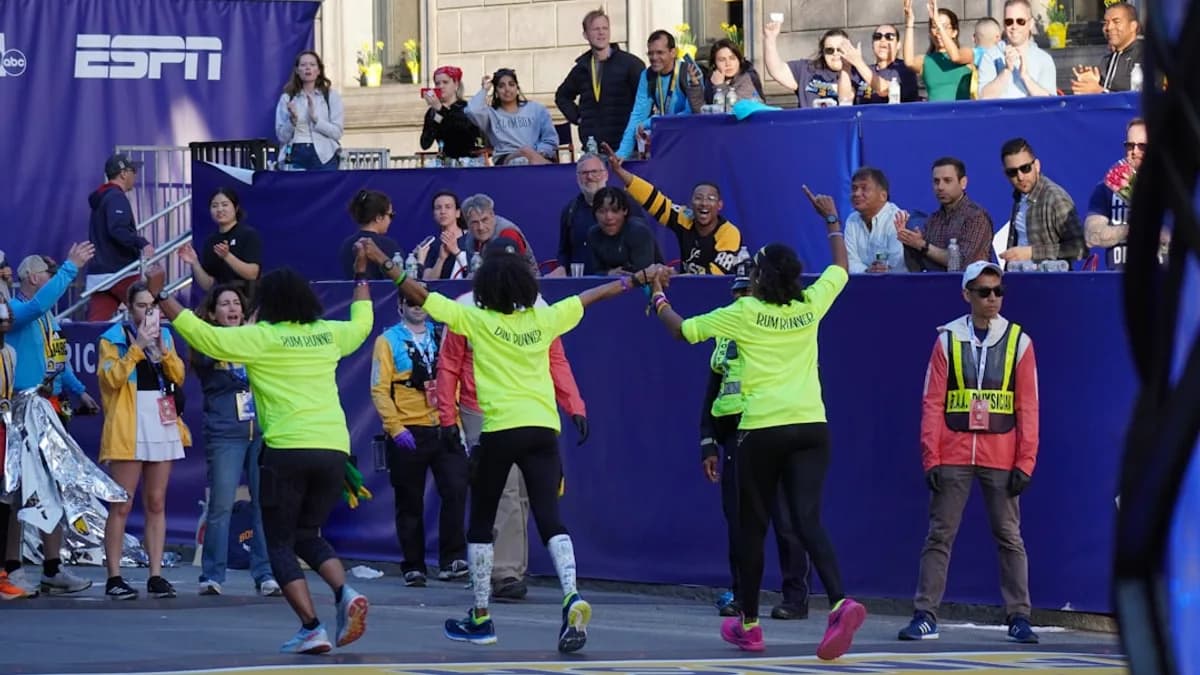 a group of people standing on top of a street