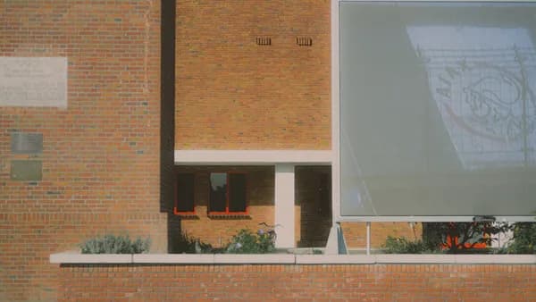 Modern brick building with large glass panel
