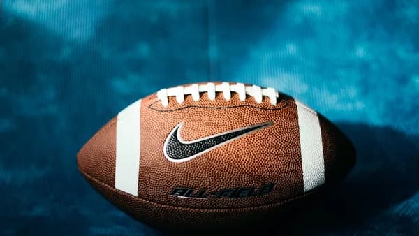 a close up of a football on a blue background