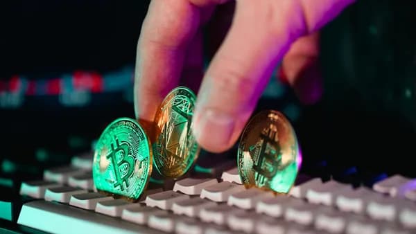 A person is typing on a computer keyboard