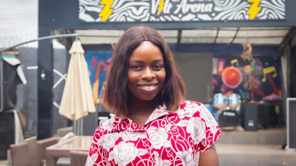 A woman standing in front of a building