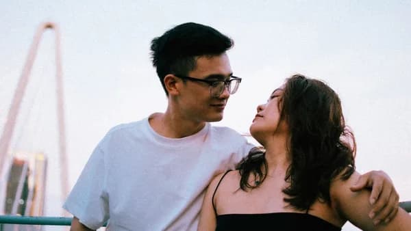 a man and a woman standing next to each other