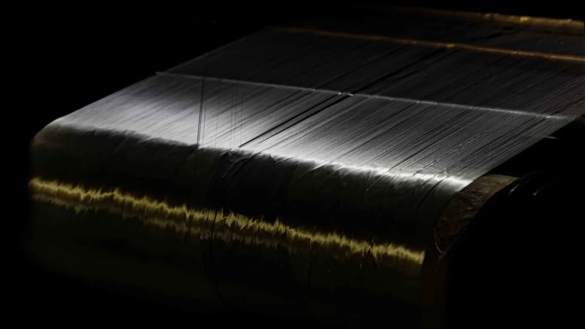 Close-up of fine threads on a dark background