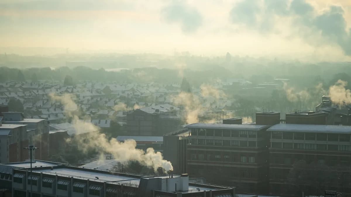 a city with a lot of smoke coming out of it