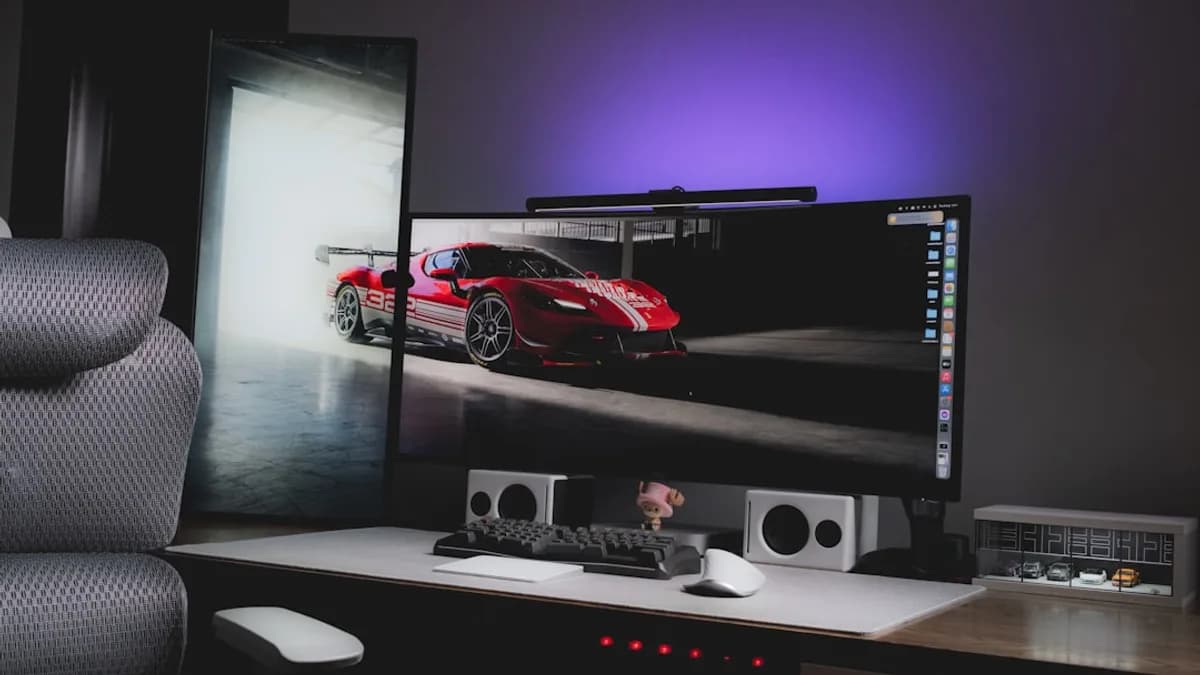 A computer desk with a monitor and keyboard