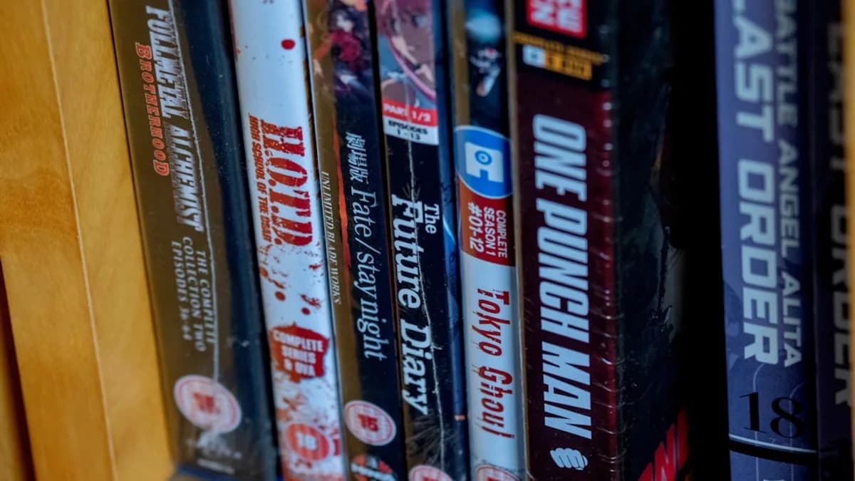 Anime blu-ray and dvd movies are neatly arranged on a shelf.