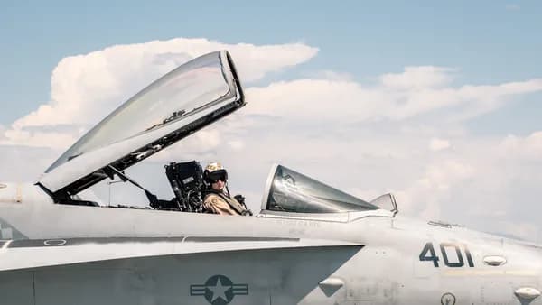 a couple of men in a jet