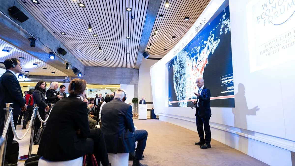man standing beside projecting wall in front of people
