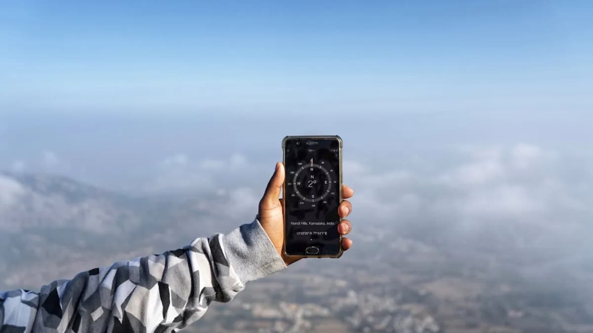 person holding black smartphone taking photo of blue sky during daytime