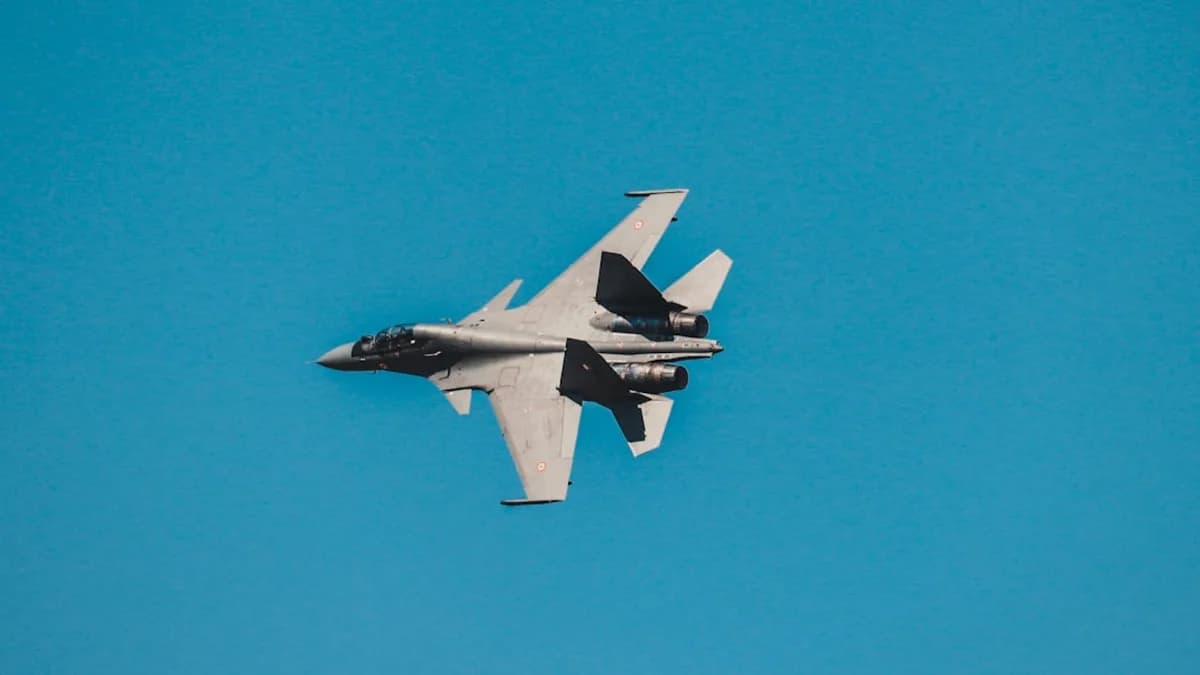 grey fighter jet under blue sky
