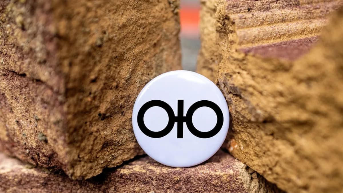 a button that is sitting on some rocks