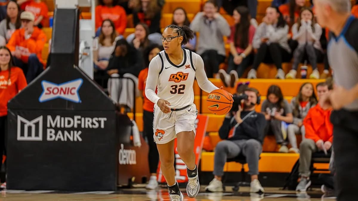 Basketball player dribbles ball on court