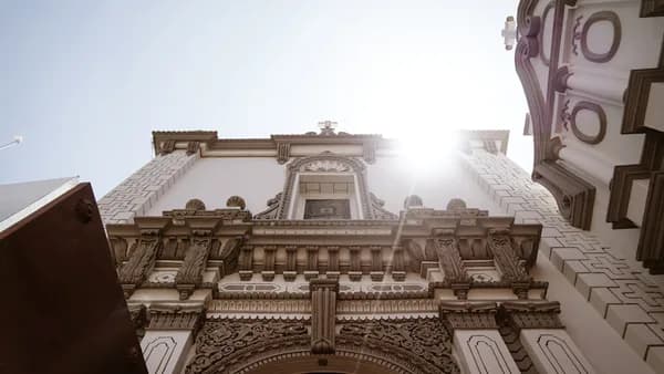 a large building with a clock on the front of it