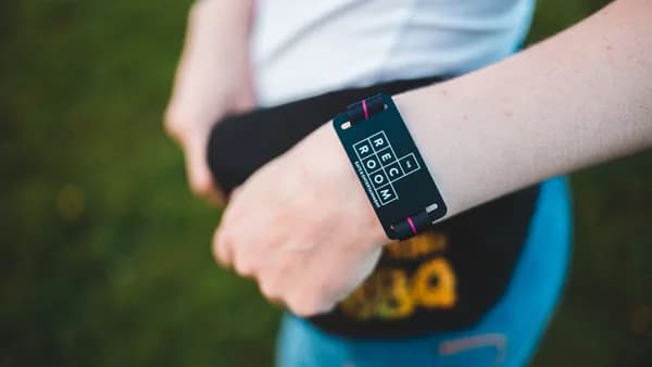 peson wearing black fitness tracker standing