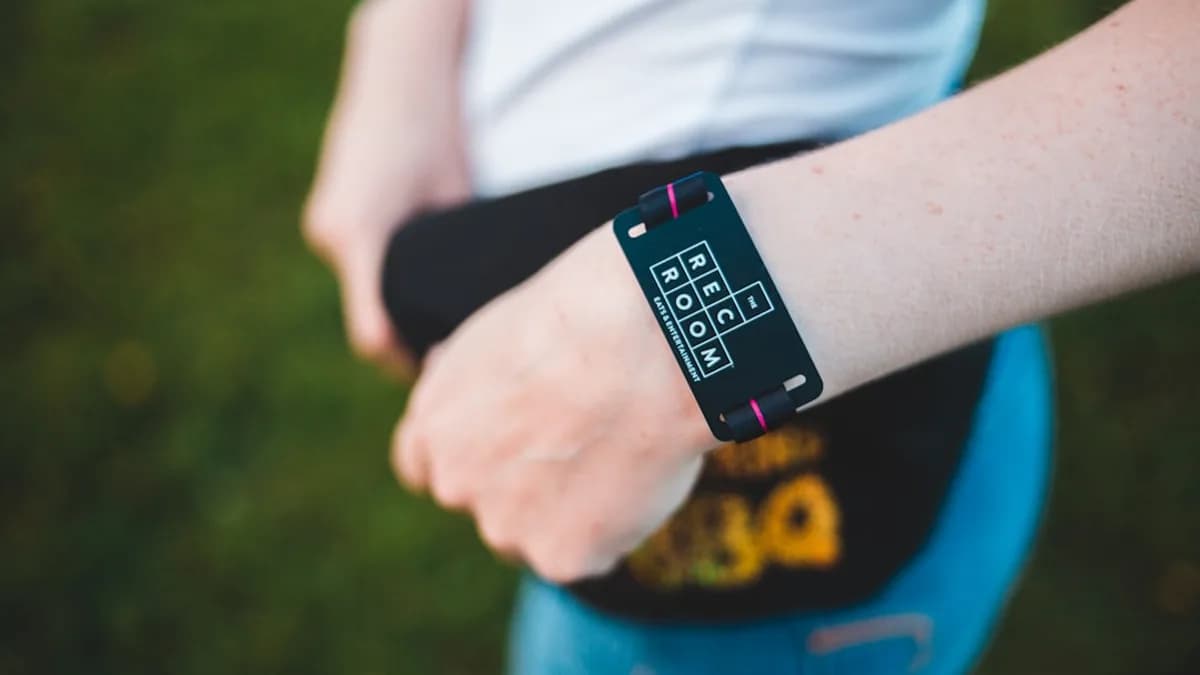 peson wearing black fitness tracker standing