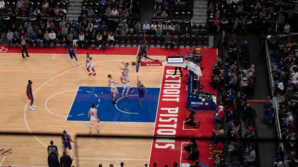 people playing basketball on court