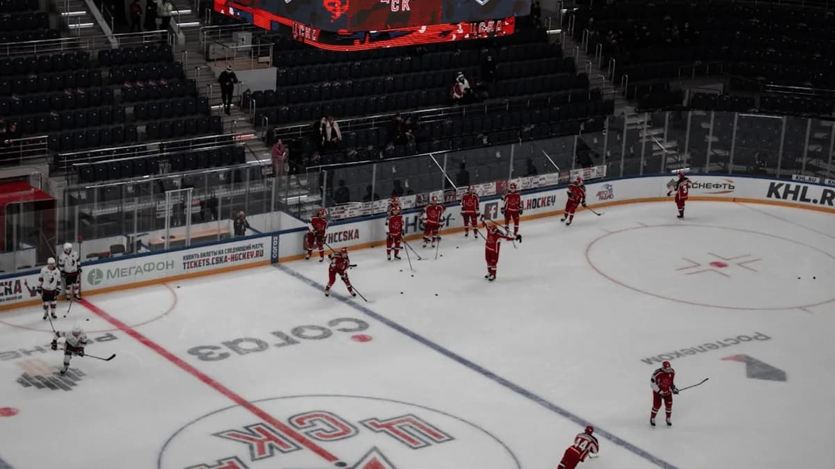 people playing ice hockey on ice stadium