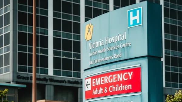 Victoria hospital emergency entrance sign with building
