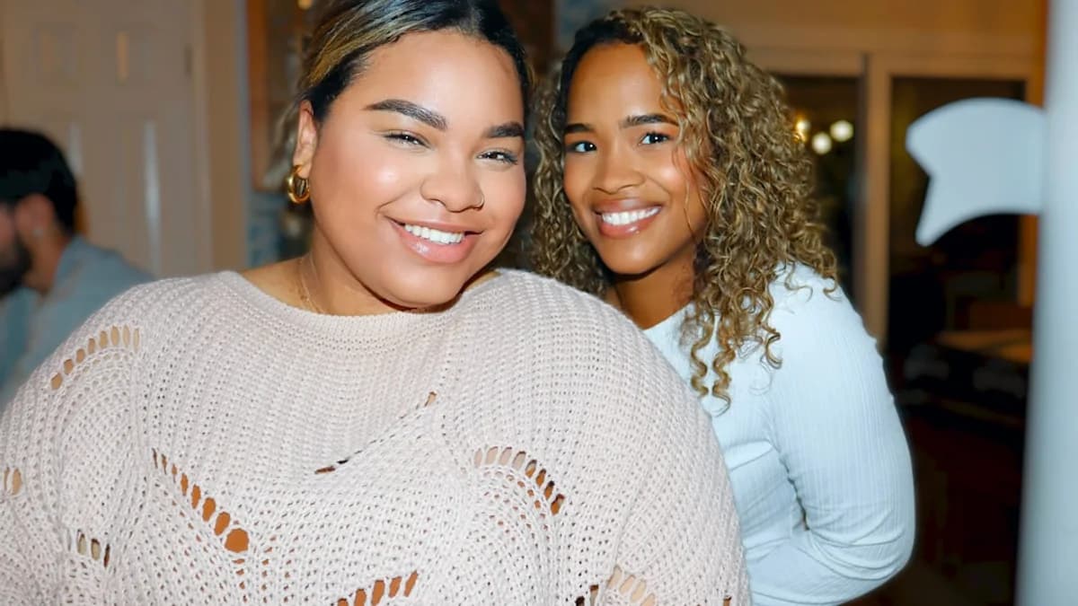 a couple of women standing next to each other