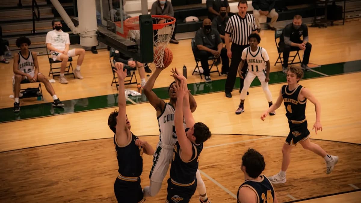 basketball players playing on basketball court