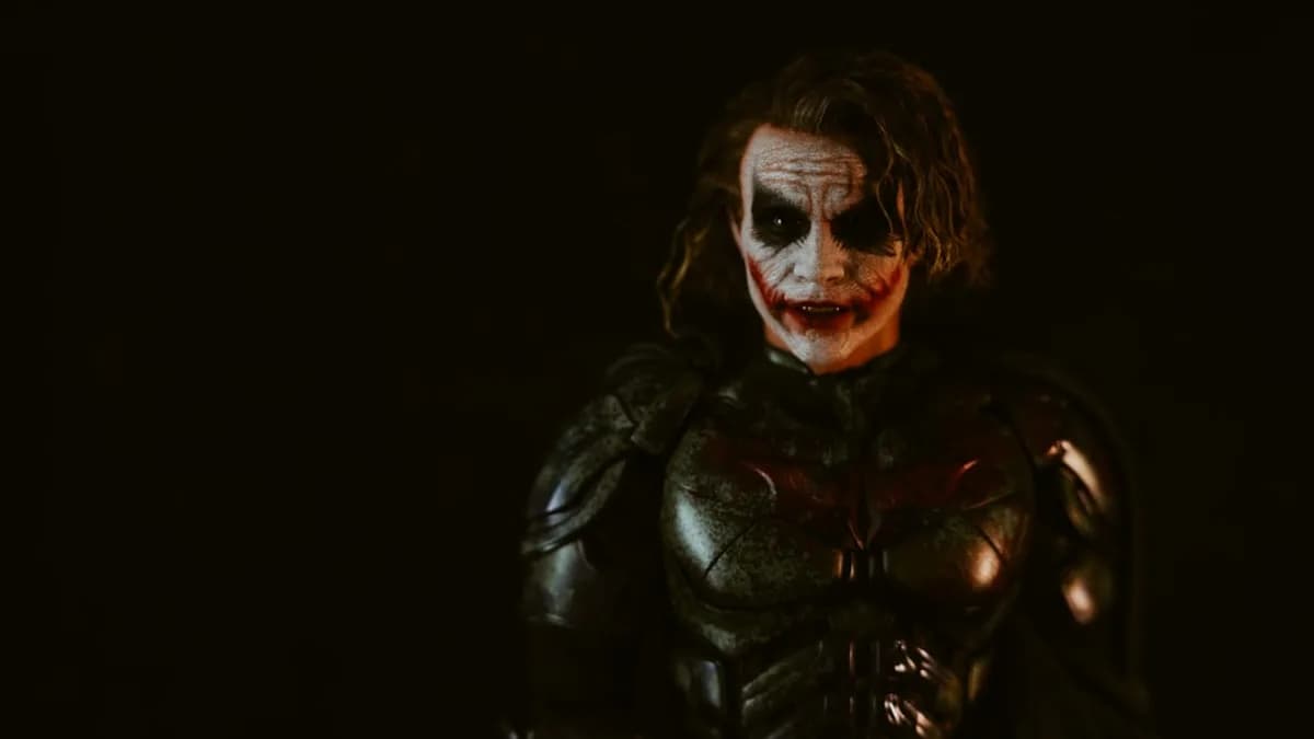 Man in joker costume with dark makeup and armor