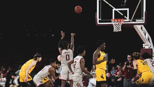 man shooting the ball on the free throw line