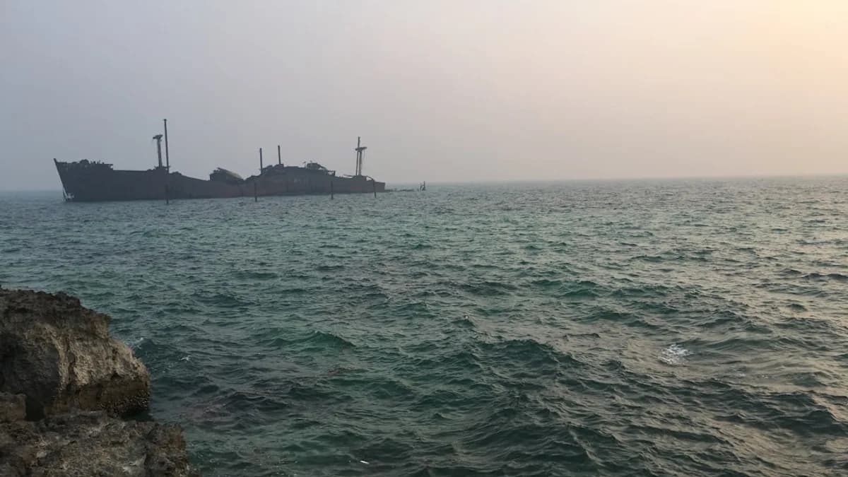 body of water under white sky during daytime