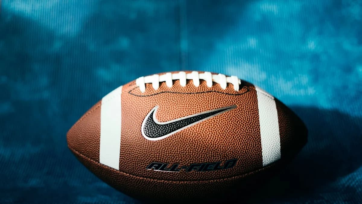 a close up of a football on a blue background