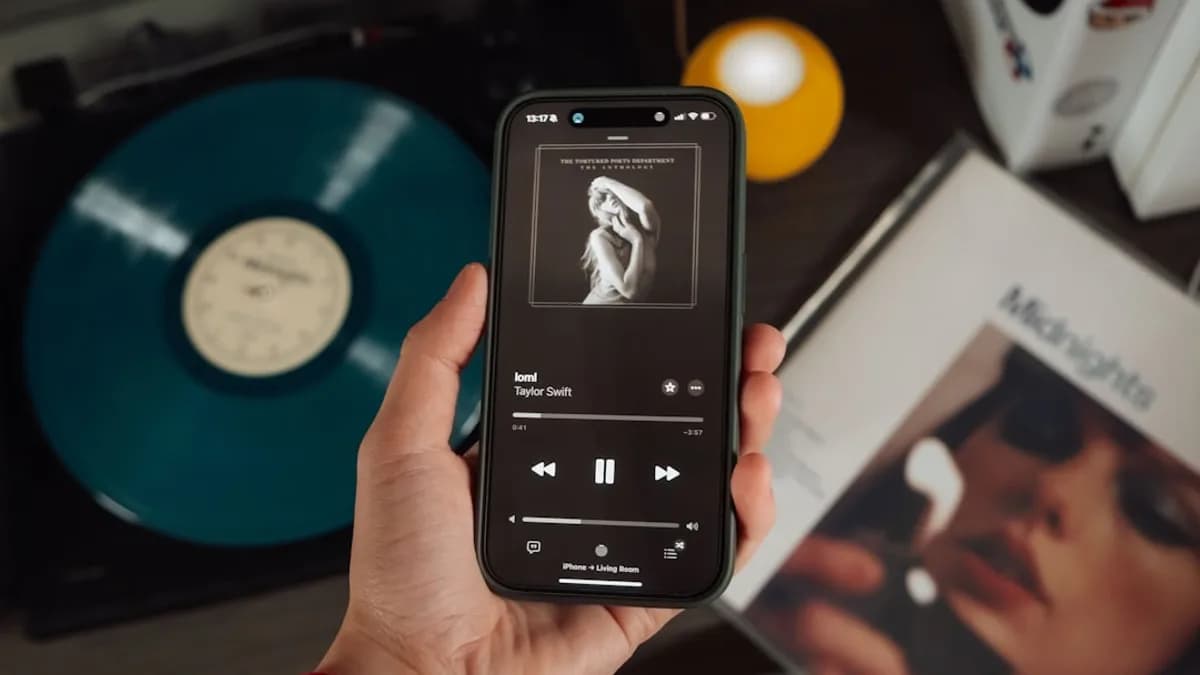 a person holding a cell phone in their hand