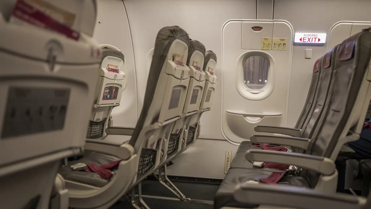 Empty airplane cabin with rows of seats