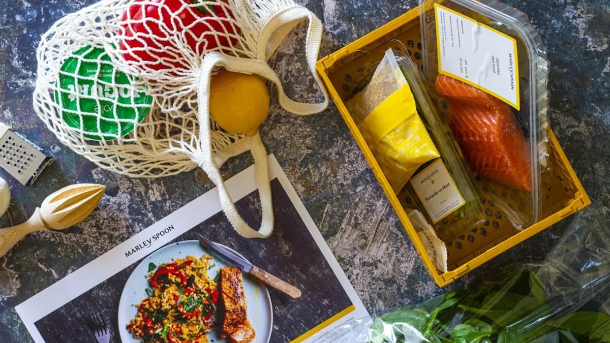 brown wooden tray with food and sliced lemon