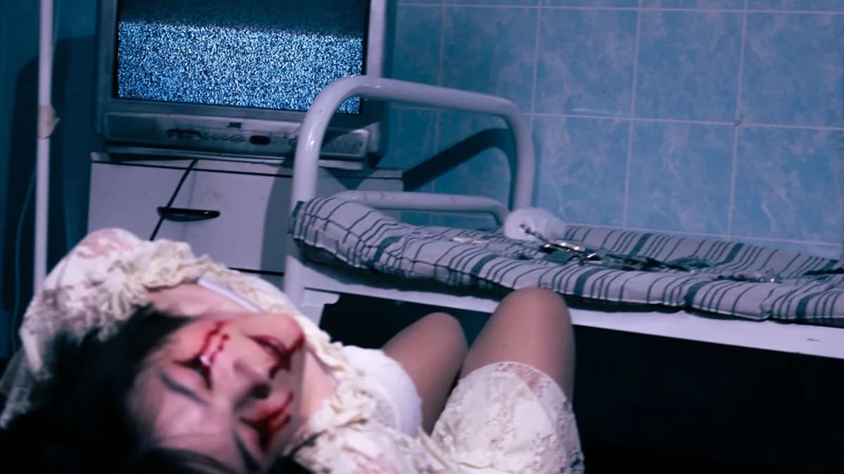 a woman laying down in a hospital room