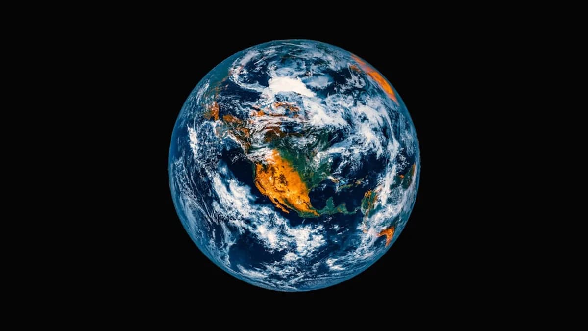 Planet earth viewed from space with clouds and continents.