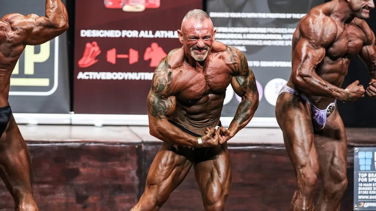 a group of men standing next to each other on a stage