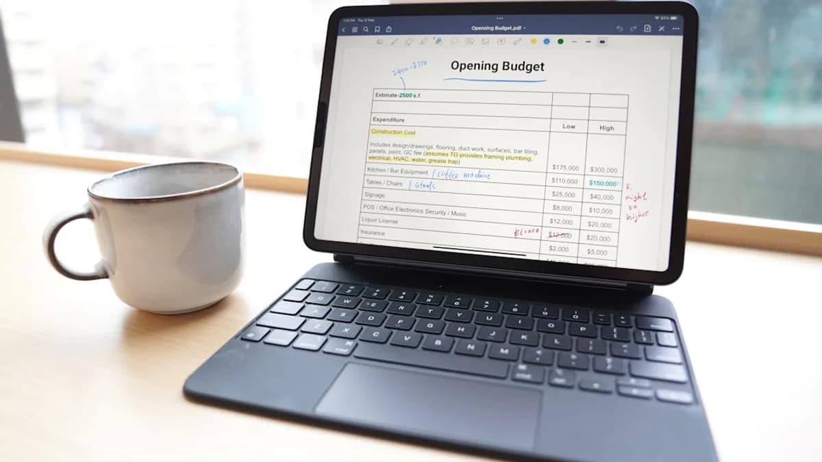 a laptop and a cup of coffee