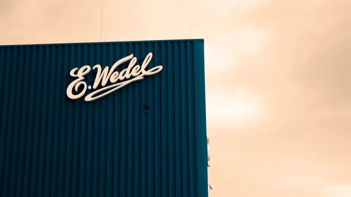 E. wedel logo on a blue building facade
