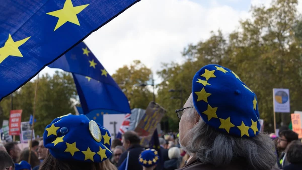 a group of people with blue and yellow hats