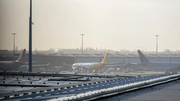an airport filled with lots of parked airplanes