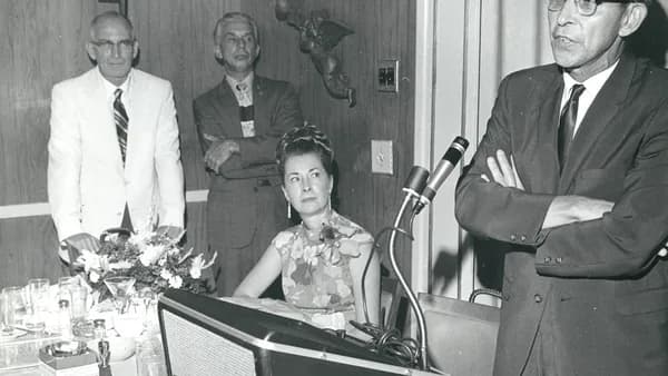 man standing near microphne