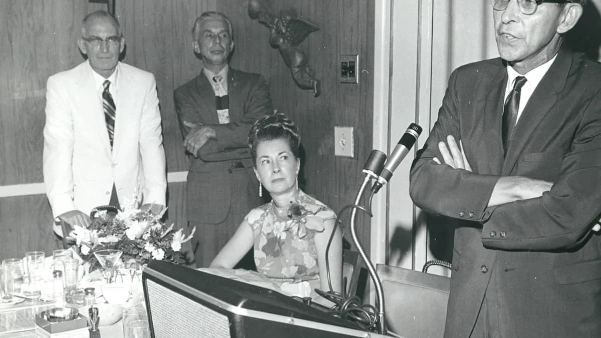 man standing near microphne