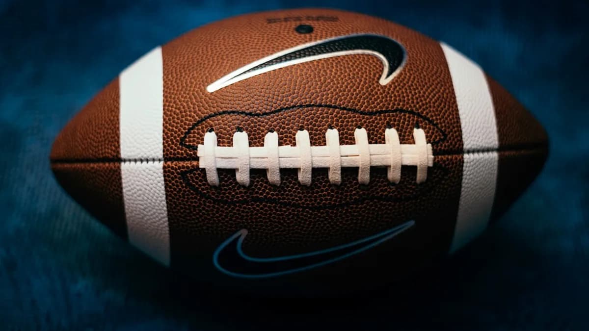 a close up of a football on a blue background