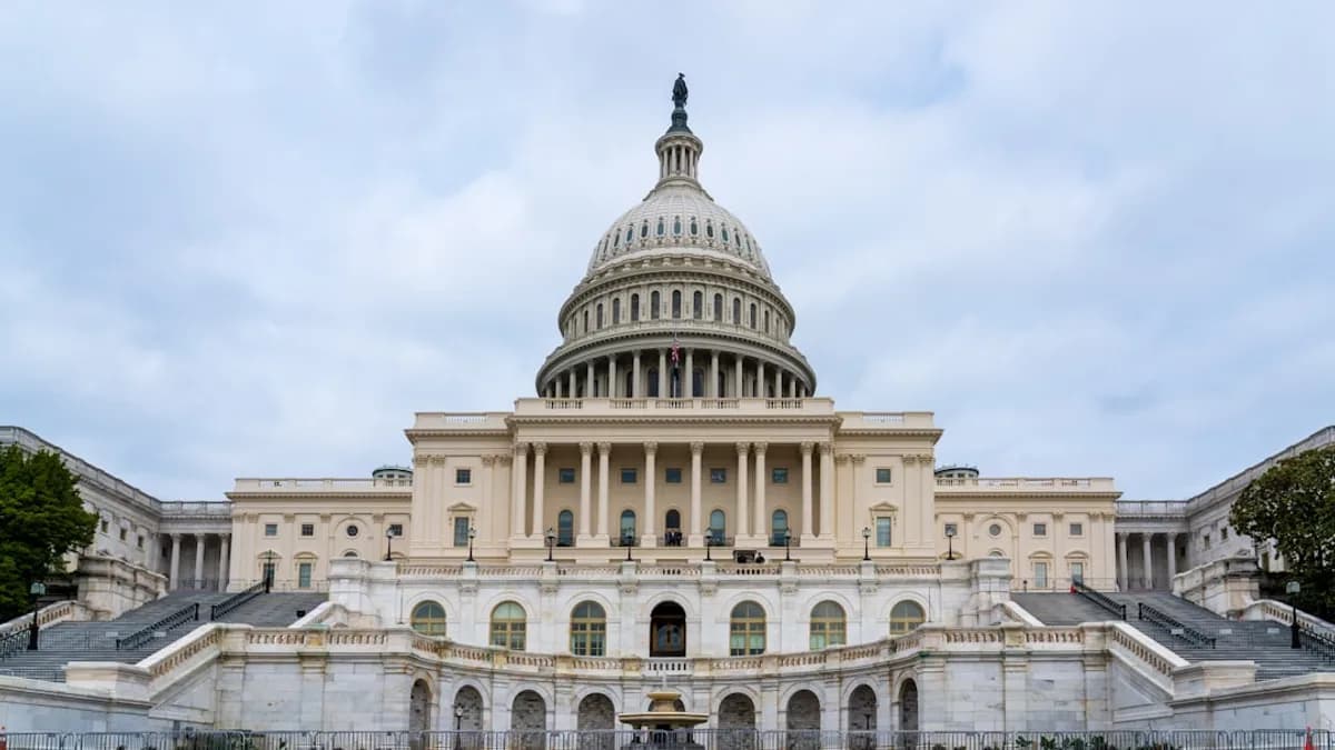 A large building with a fountain in front of it
