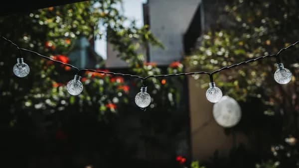 a bunch of lights hanging from a wire
