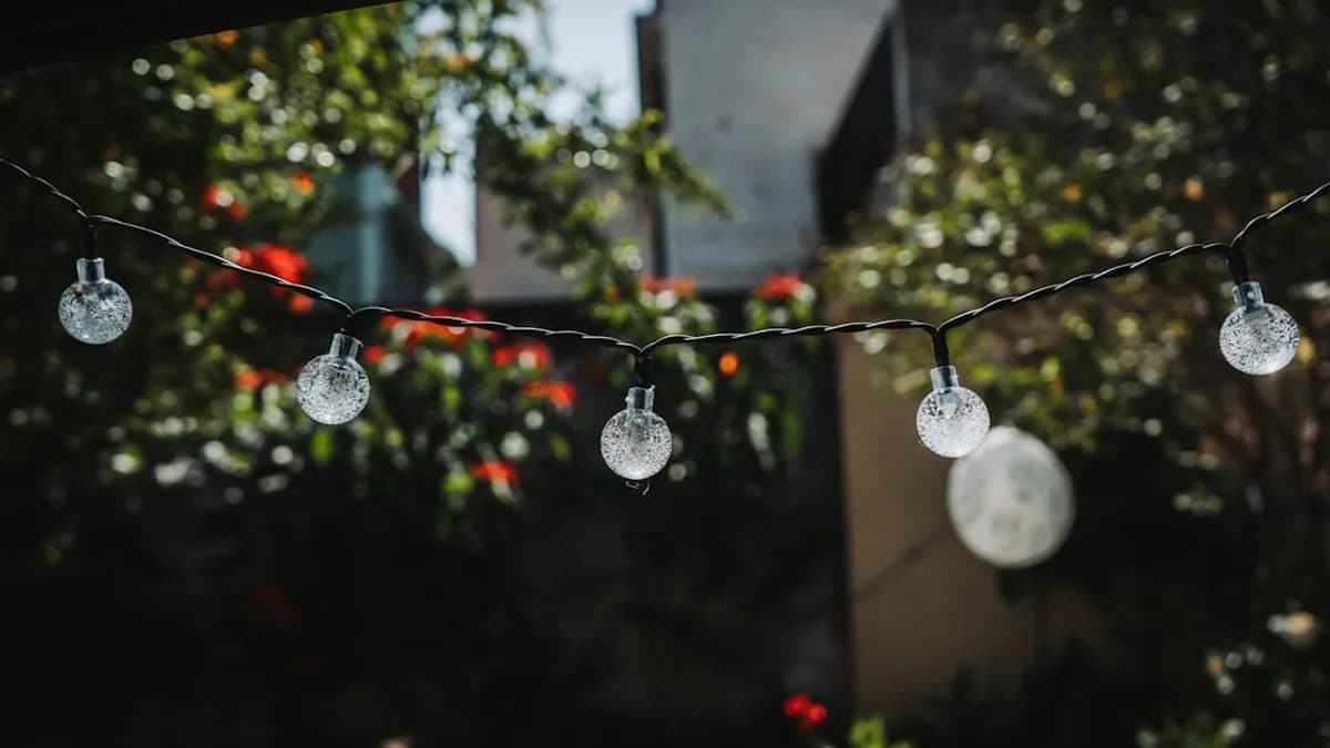 a bunch of lights hanging from a wire