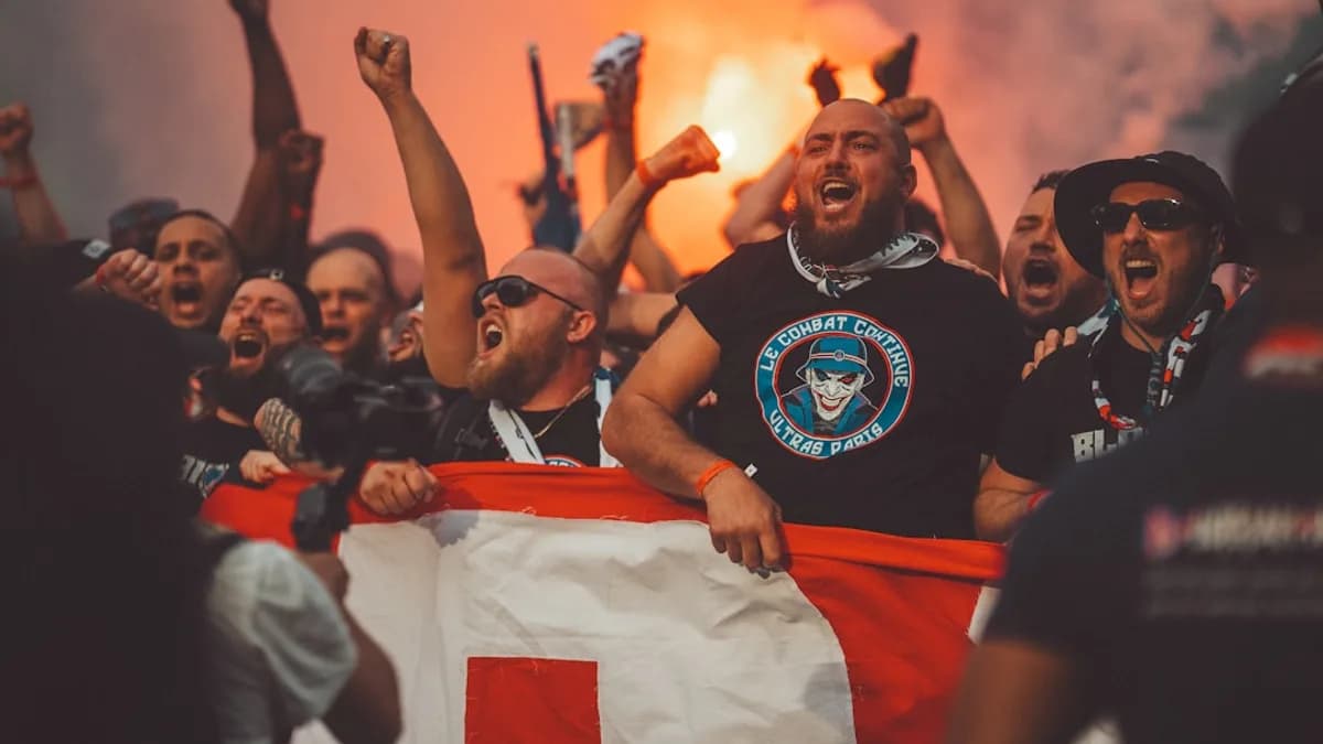 a group of people holding a flag and cheering